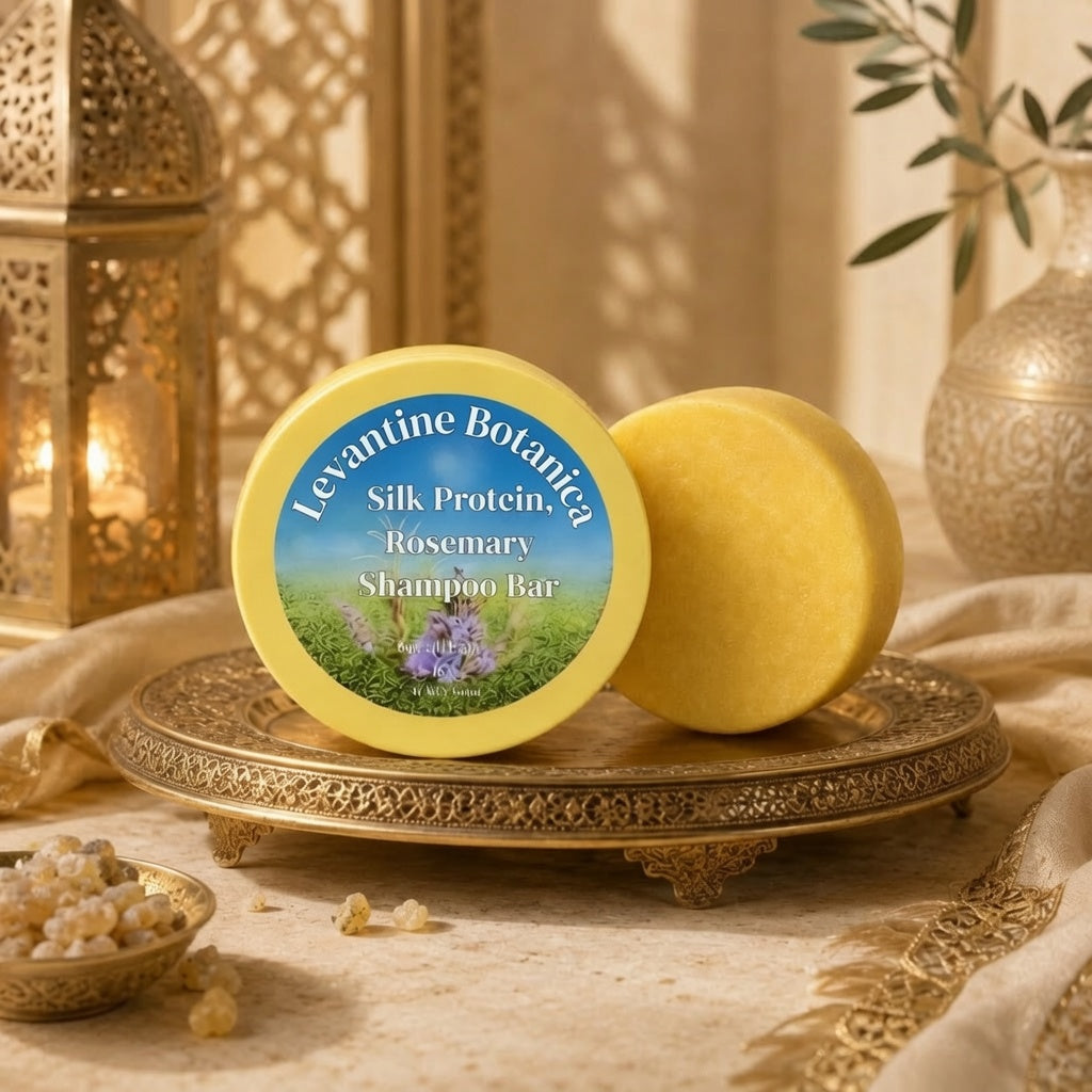 Levantine Botanica batana and silk protein shampoo bar, plastic-free, on a gold tray.